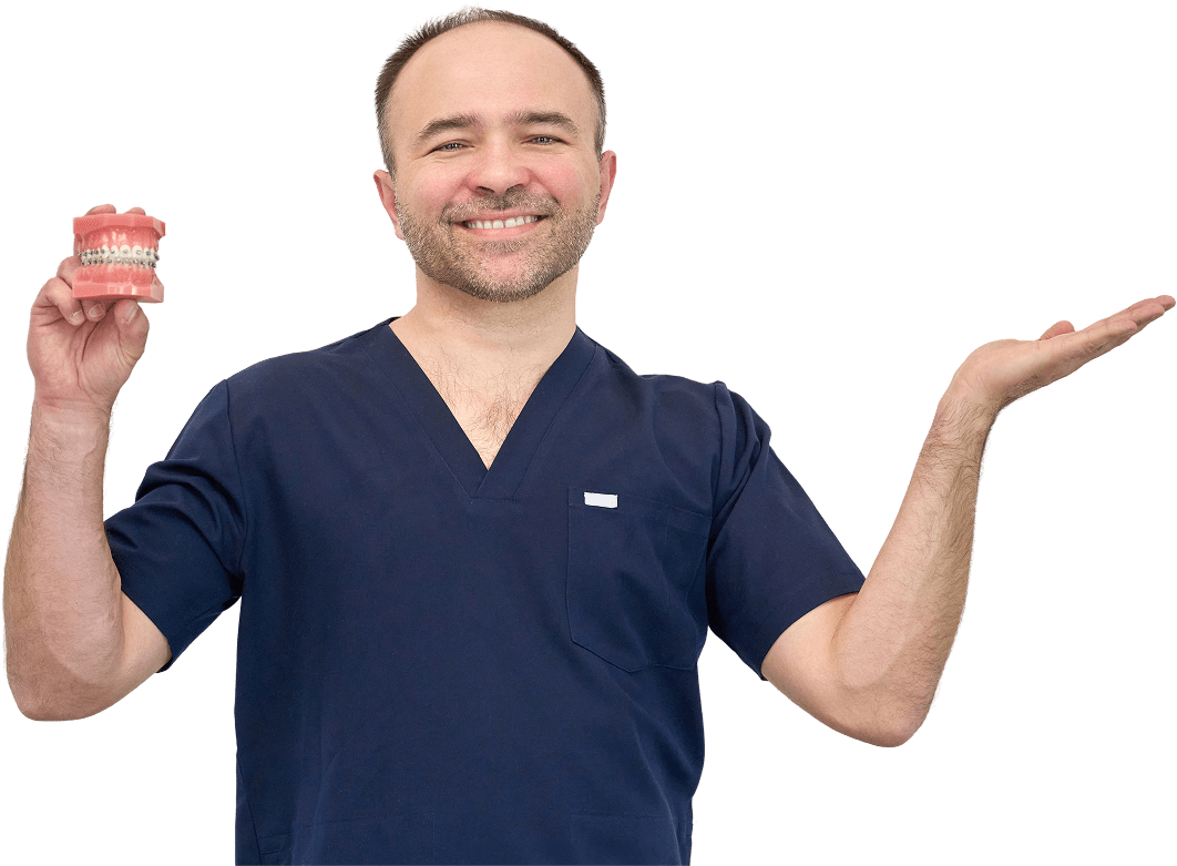 Baner Goździkowski z ilustracją zębów i aparatu ortodontycznego na stronie poradnika